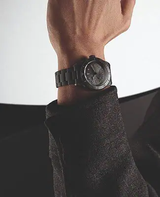 Man wearing a black Tudor watch on his wrist - Washington Watches