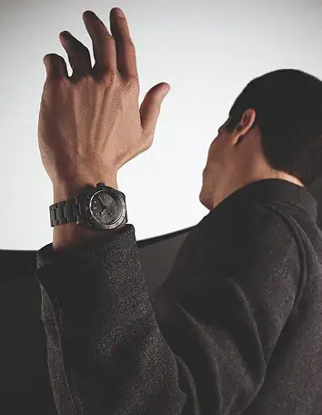 Man wearing a black Tudor watch on his wrist - Washington Watches
