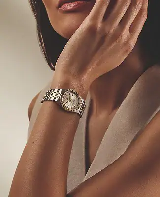 Woman wearing a Tudor watch with a silver bracelet - Washington Watches