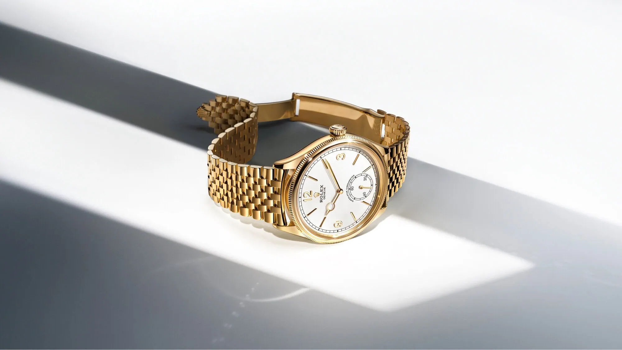 Gold Rolex 1908 watch with white dial on a bright surface - Washington Watches