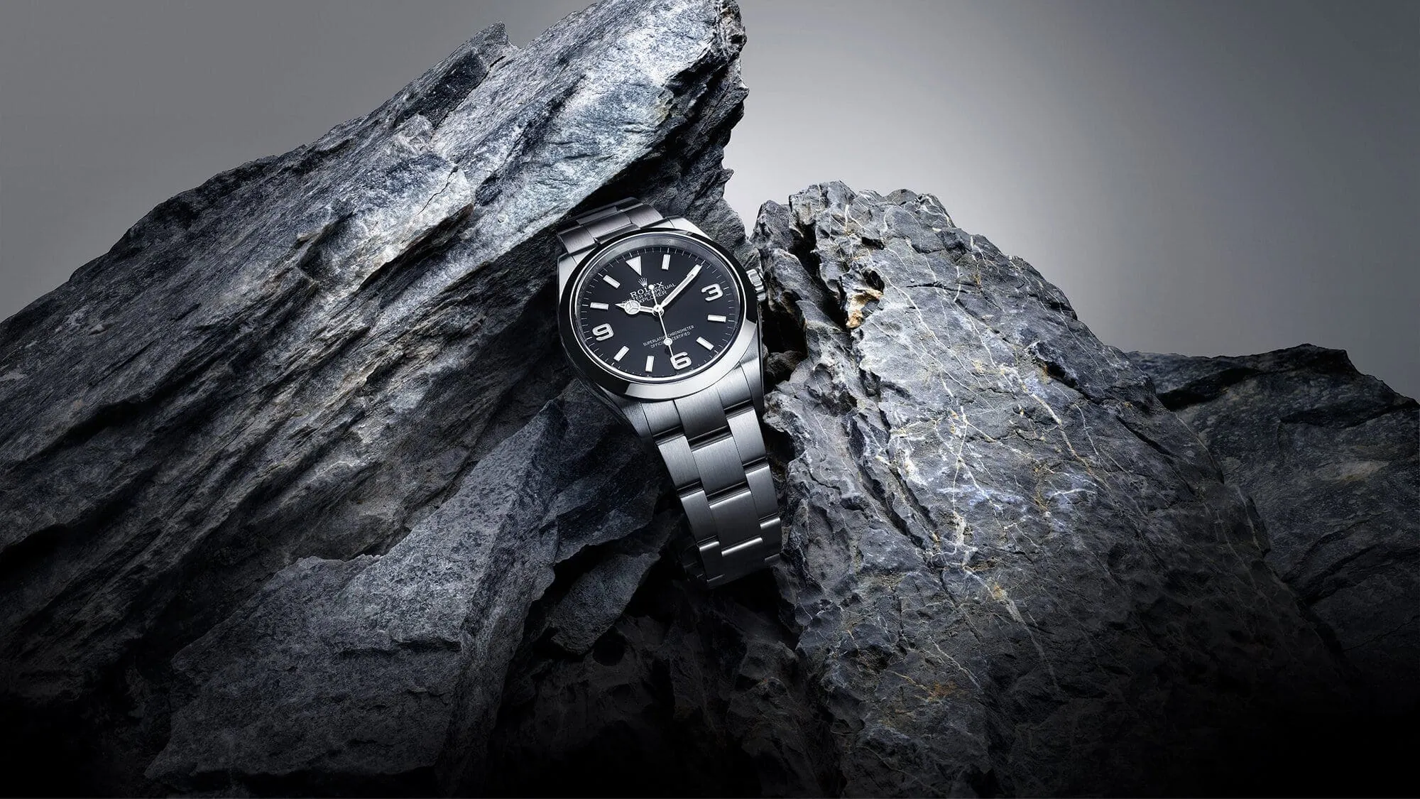 Rolex Explorer watch with black dial set among rocks - Washington Watches